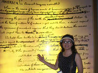 Patti standing in front of display of the draft document